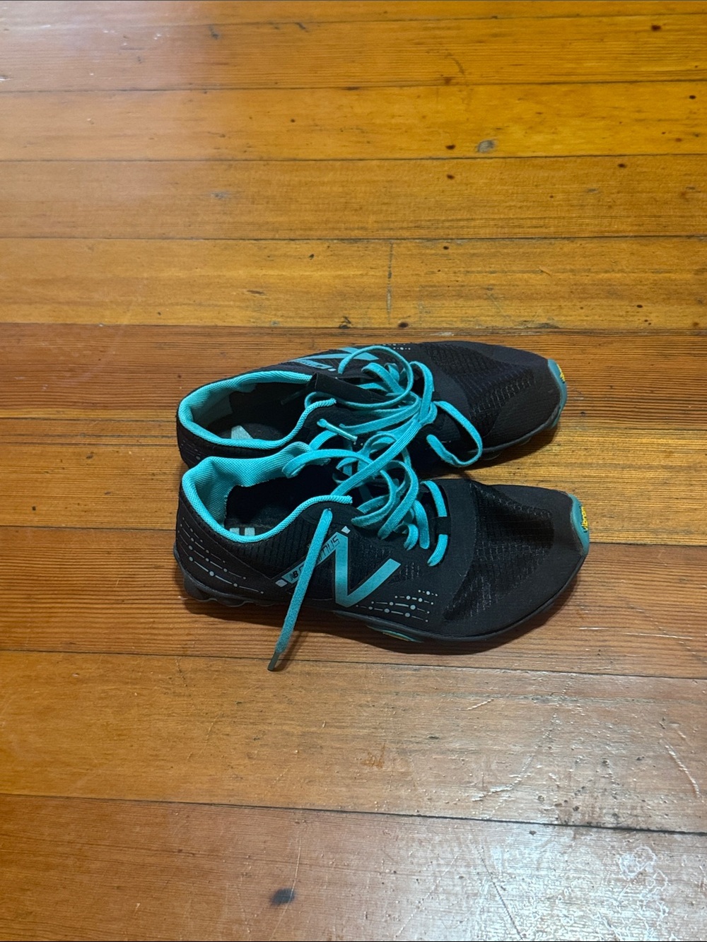 New Balance Kids Black Sneakers with Teal Accents